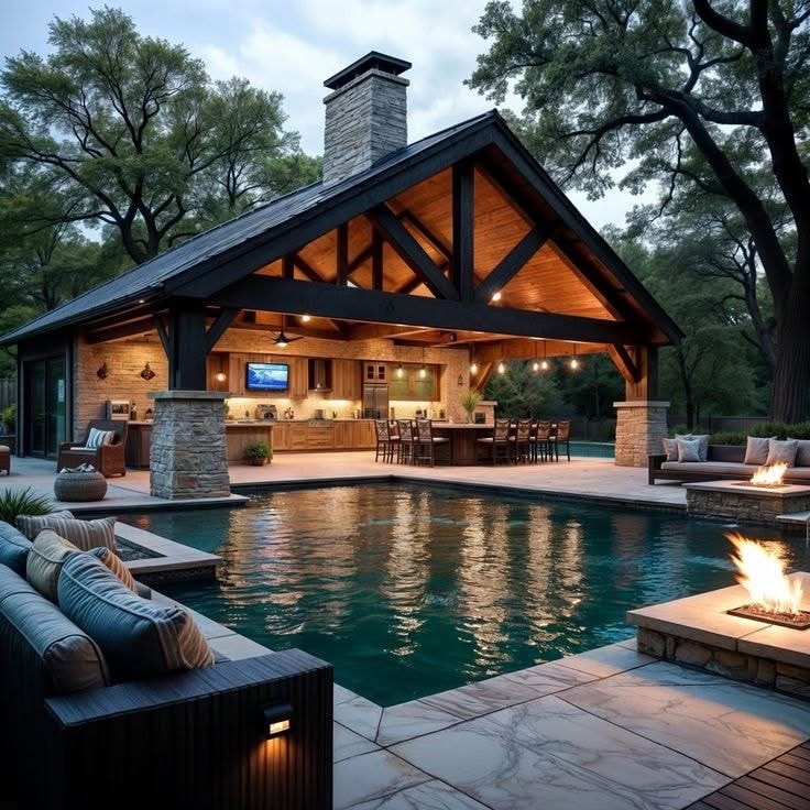 Custom swimming pool — pavilion kitchen and fire features
