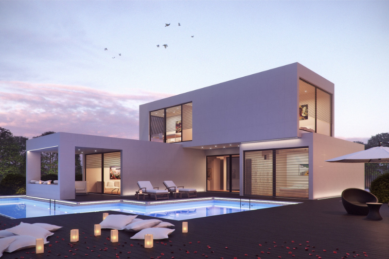 Landscape design in Mound, MN — infinity pool and villa at dusk